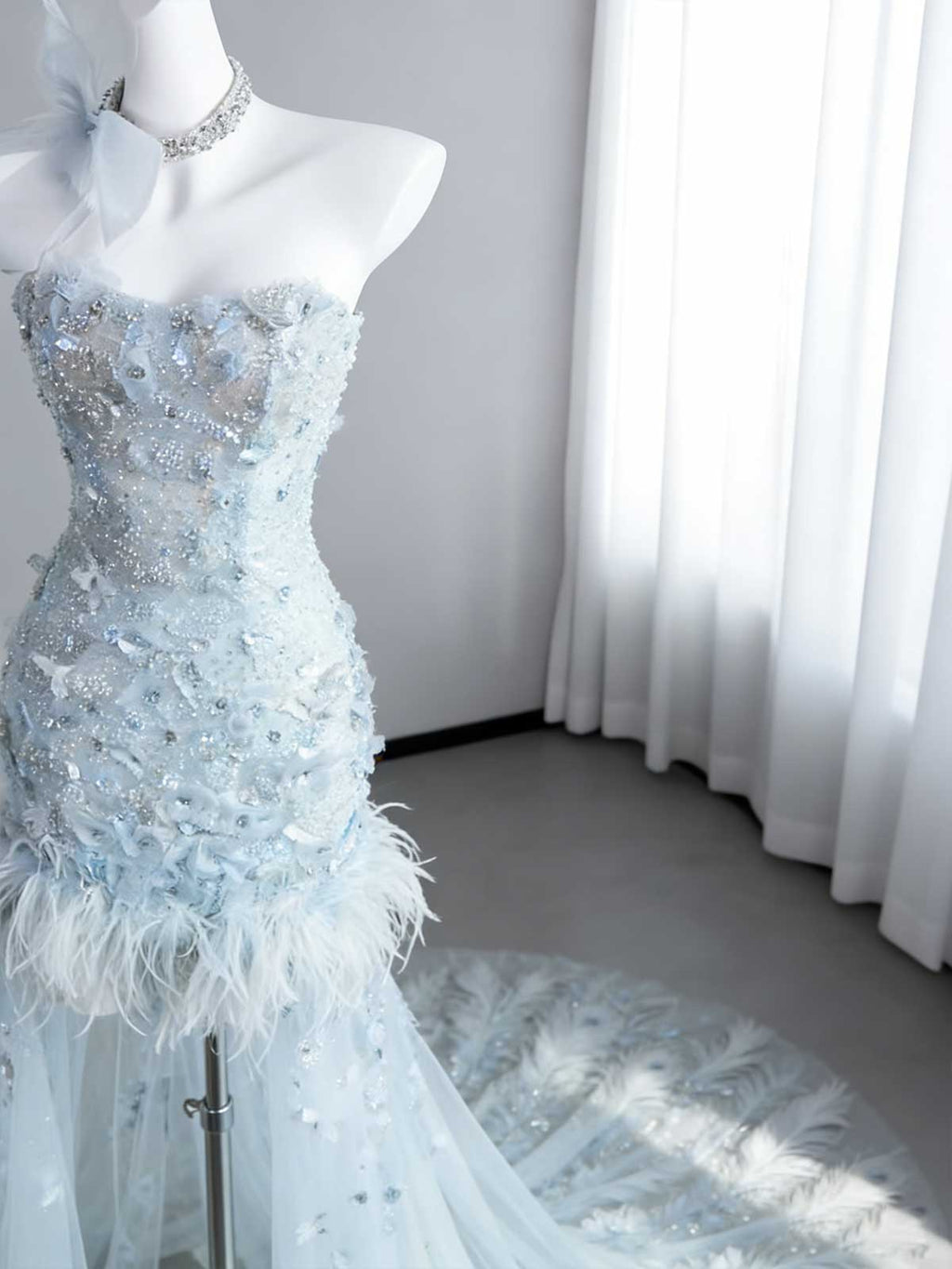 Ice Blue Beaded Feather Mermaid Evening Gown