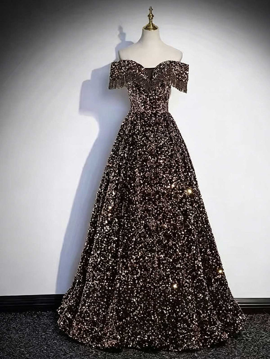 Black and Gold Off-the-Shoulder Sequin Ball Gown with Fringe Trim