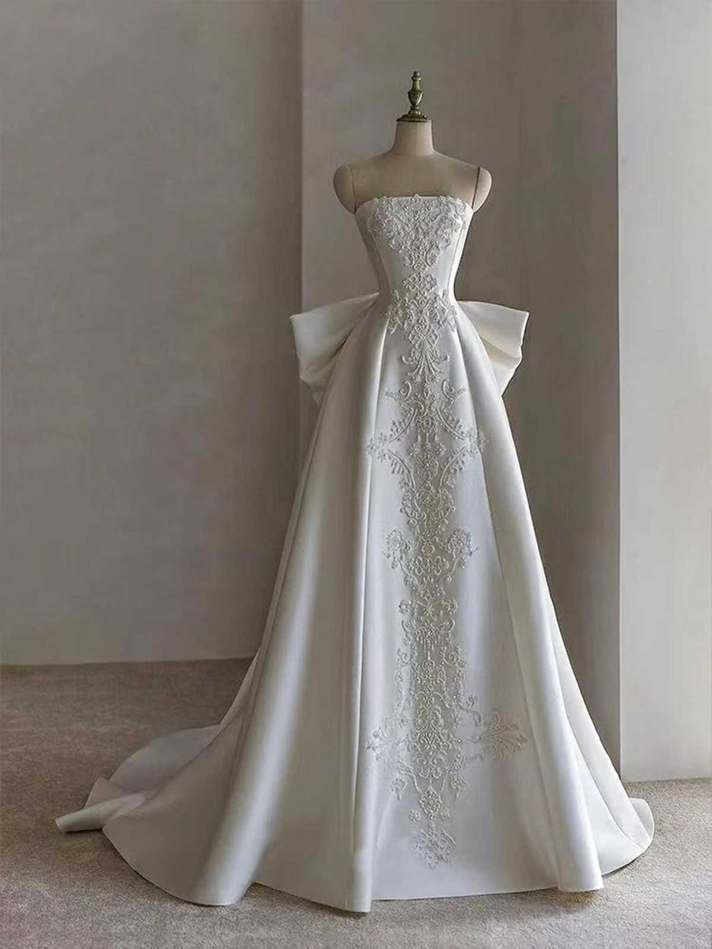 White Strapless Satin Ball Gown with Embroidered Panel & Oversized Bow Back
