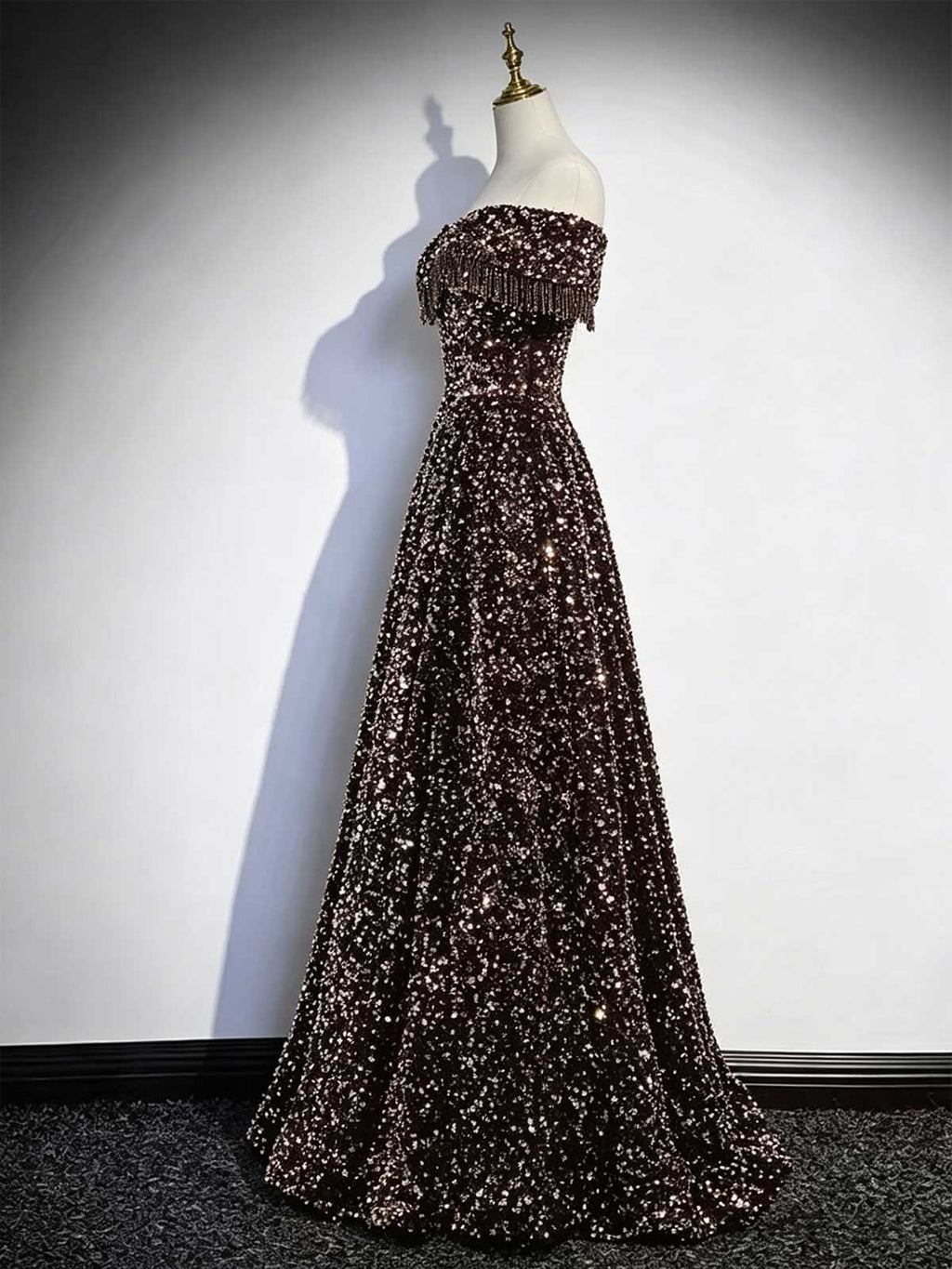 Black and Gold Off-the-Shoulder Sequin Ball Gown with Fringe Trim