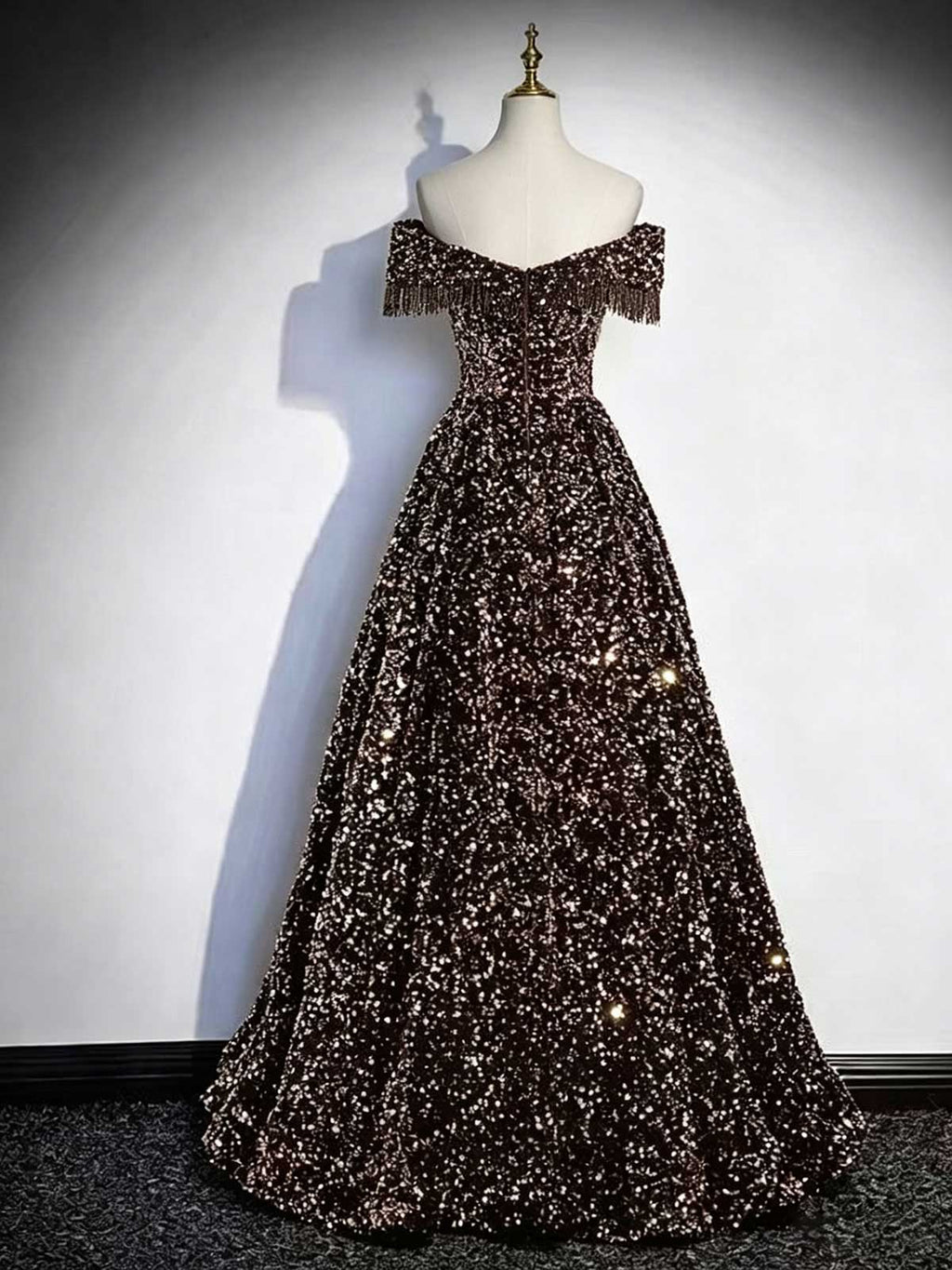 Black and Gold Off-the-Shoulder Sequin Ball Gown with Fringe Trim