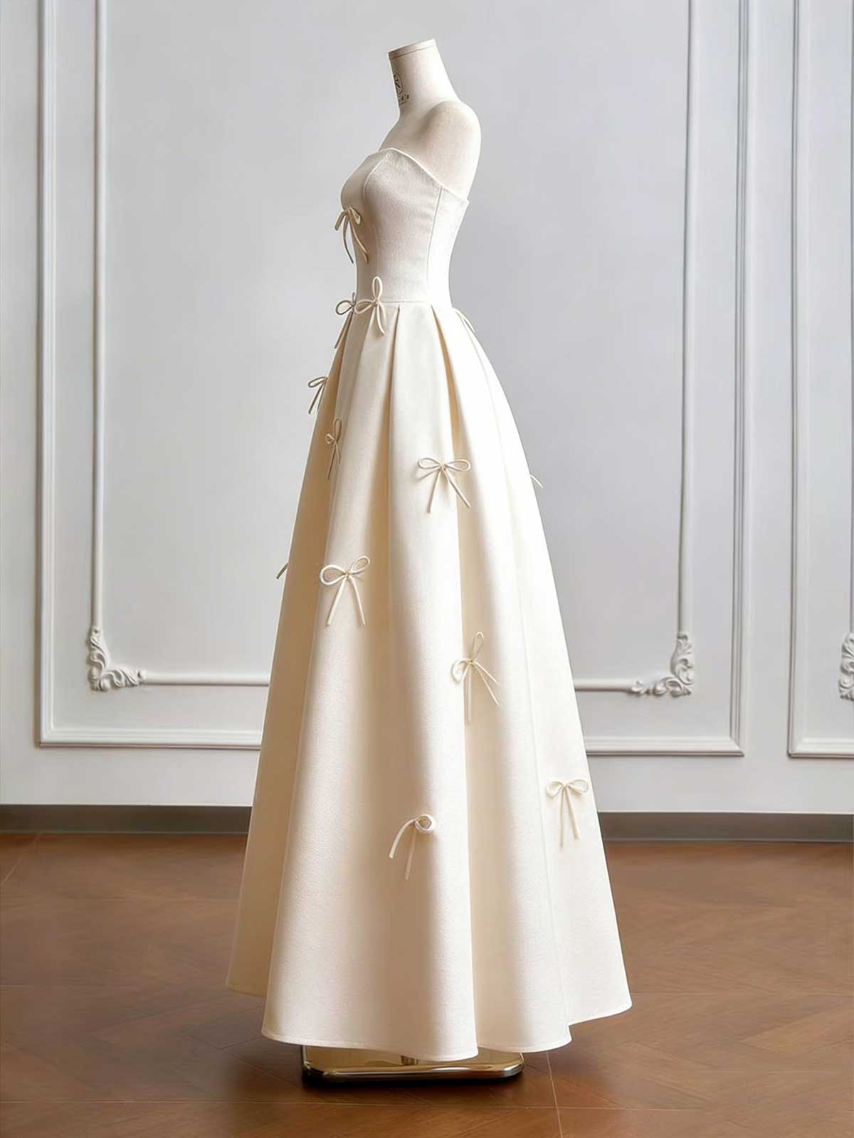 Cream Strapless Ball Gown with Delicate Bow Embellishments & Fitted Bodice