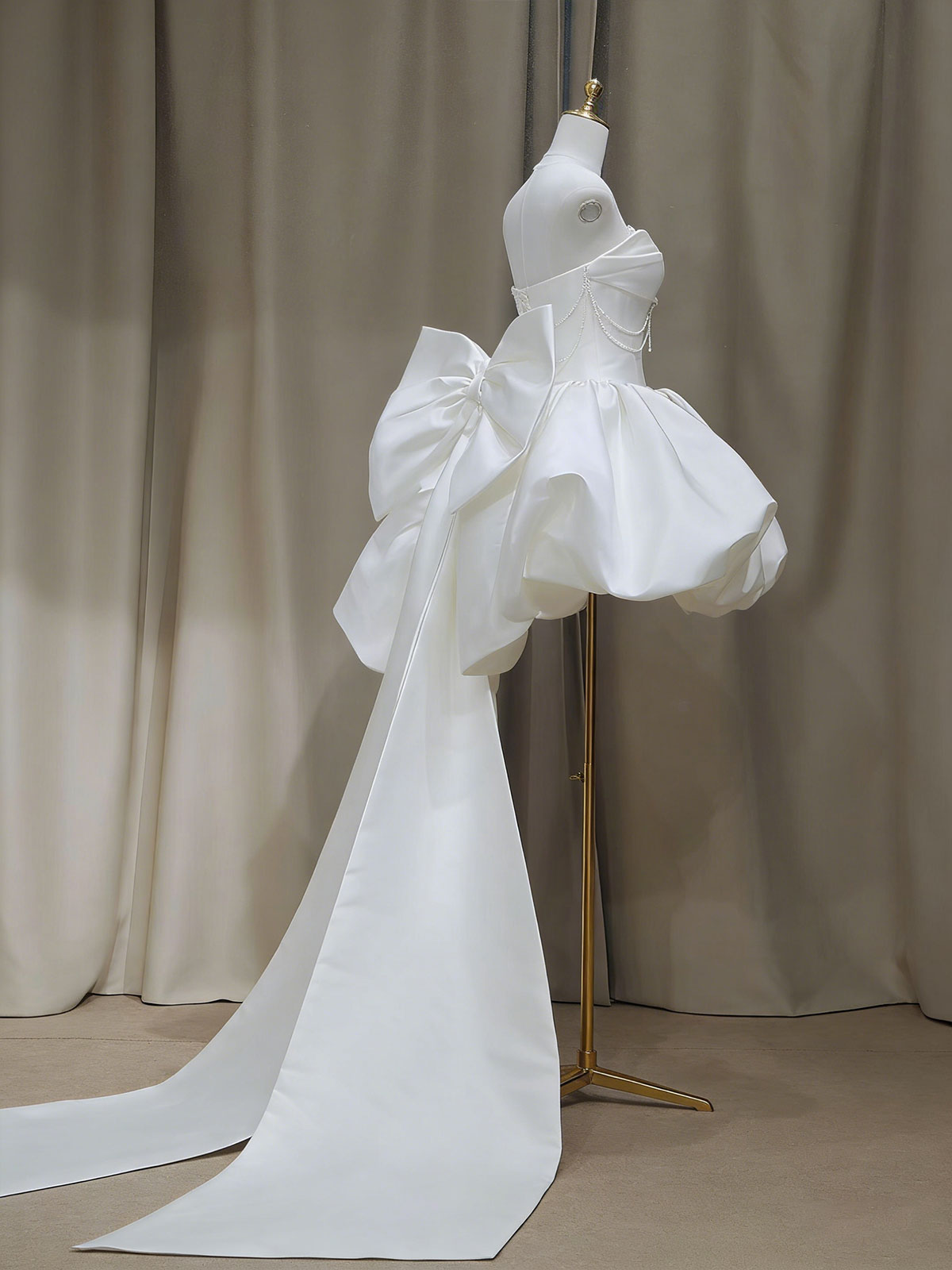 White Strapless High-Low Gown with Pearl Chains & Oversized Bow Back