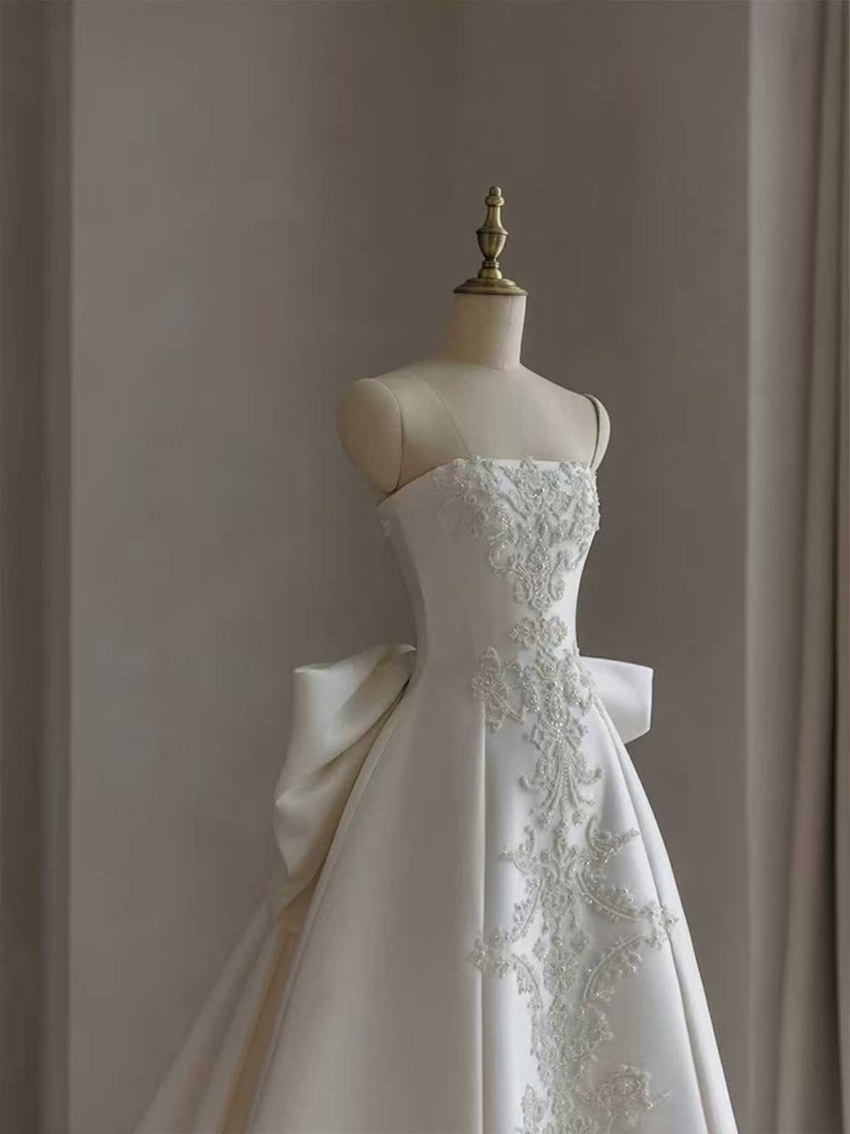 White Strapless Satin Ball Gown with Embroidered Panel & Oversized Bow Back