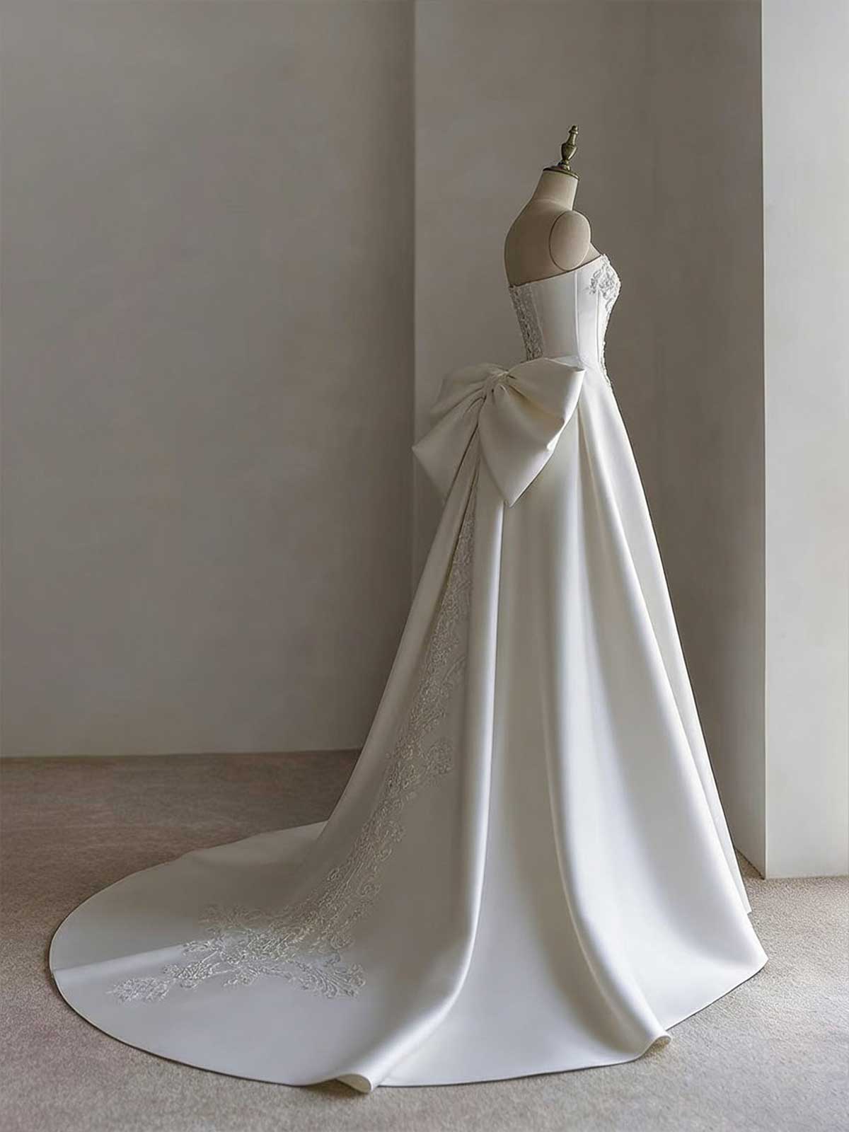 White Strapless Satin Ball Gown with Embroidered Panel & Oversized Bow Back