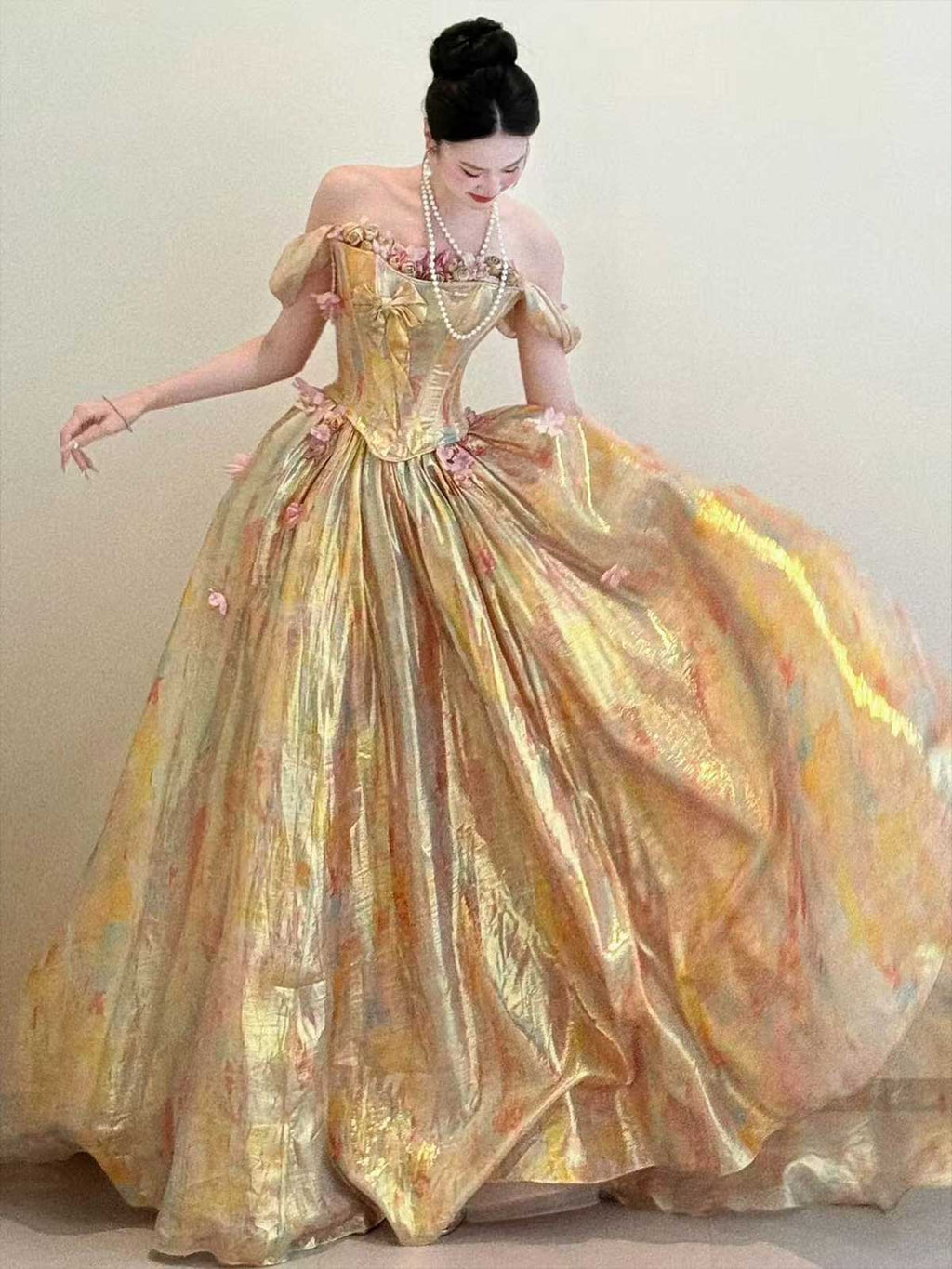 Iridescent Gold Off-the-Shoulder Corset Ball Gown with Floral Appliqués
