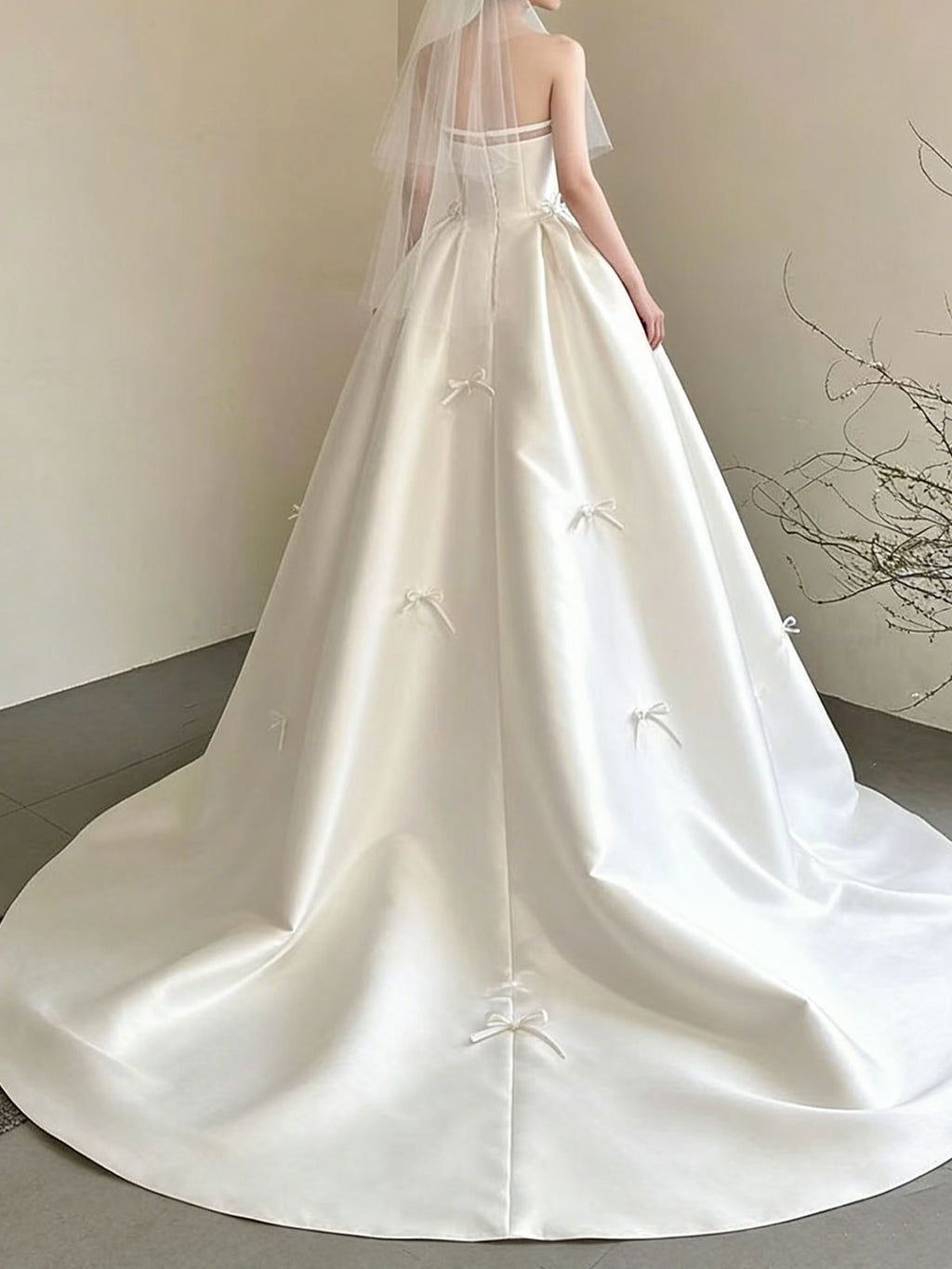 Sweet Strapless Satin Ball Gown with Delicate Bow Embellishments & Sheer Neckline