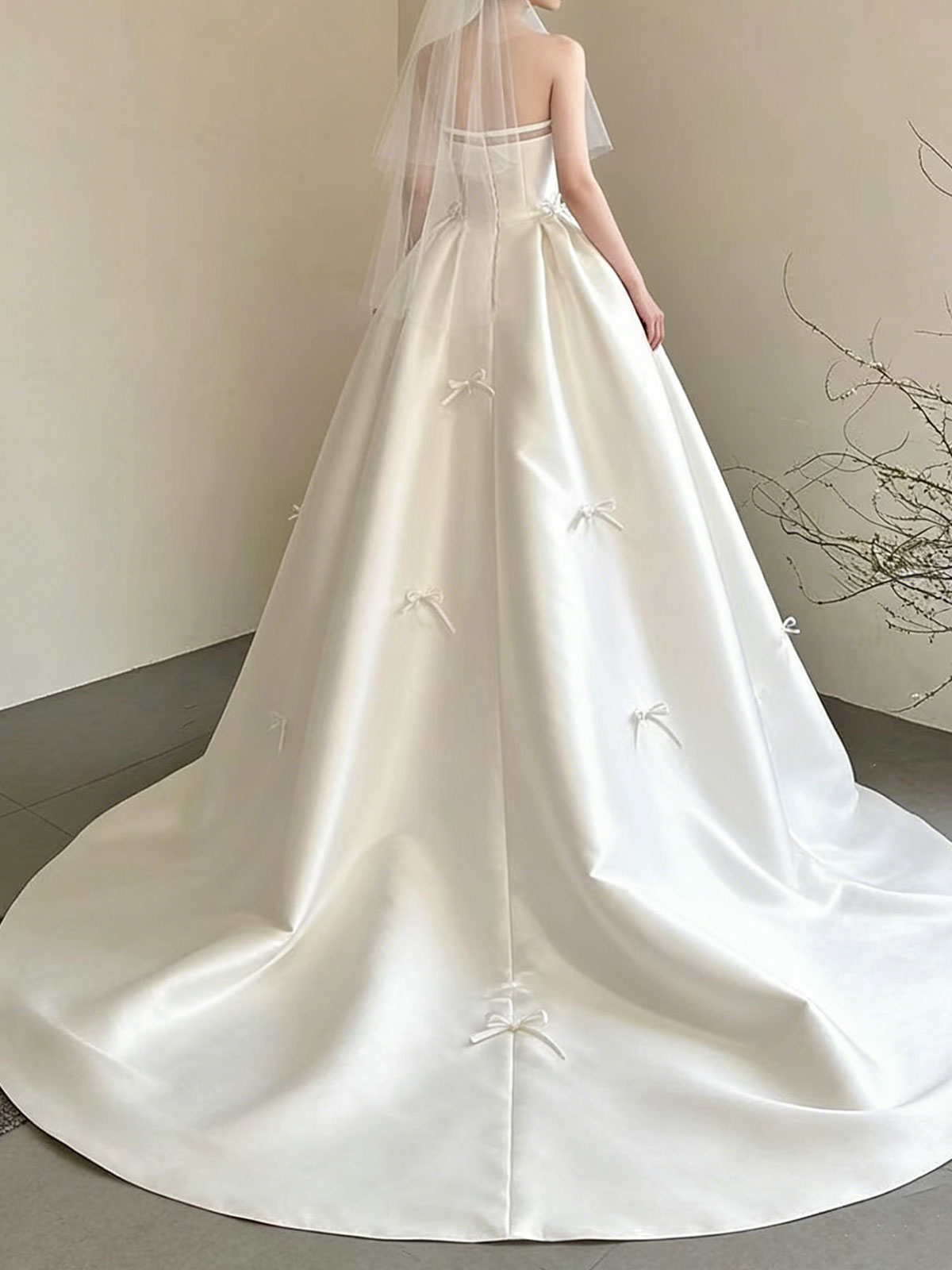 Sweet Strapless Satin Ball Gown with Delicate Bow Embellishments & Sheer Neckline