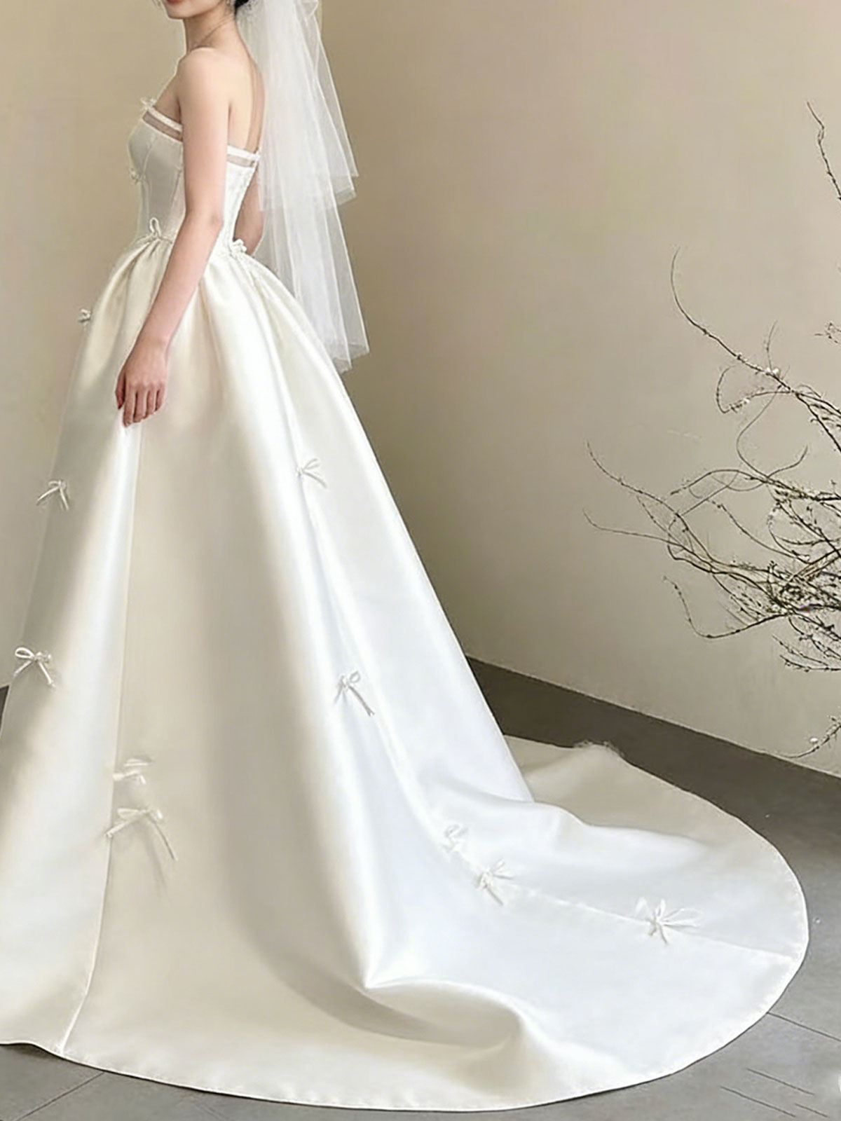 Sweet Strapless Satin Ball Gown with Delicate Bow Embellishments & Sheer Neckline